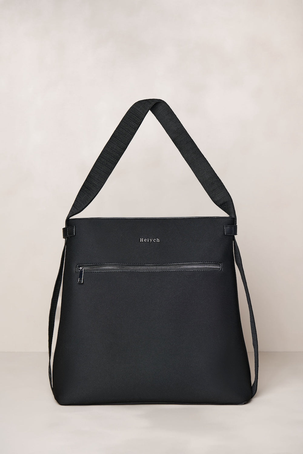 Black convertible tote backpack bag in neoprene with gunmetal hardware