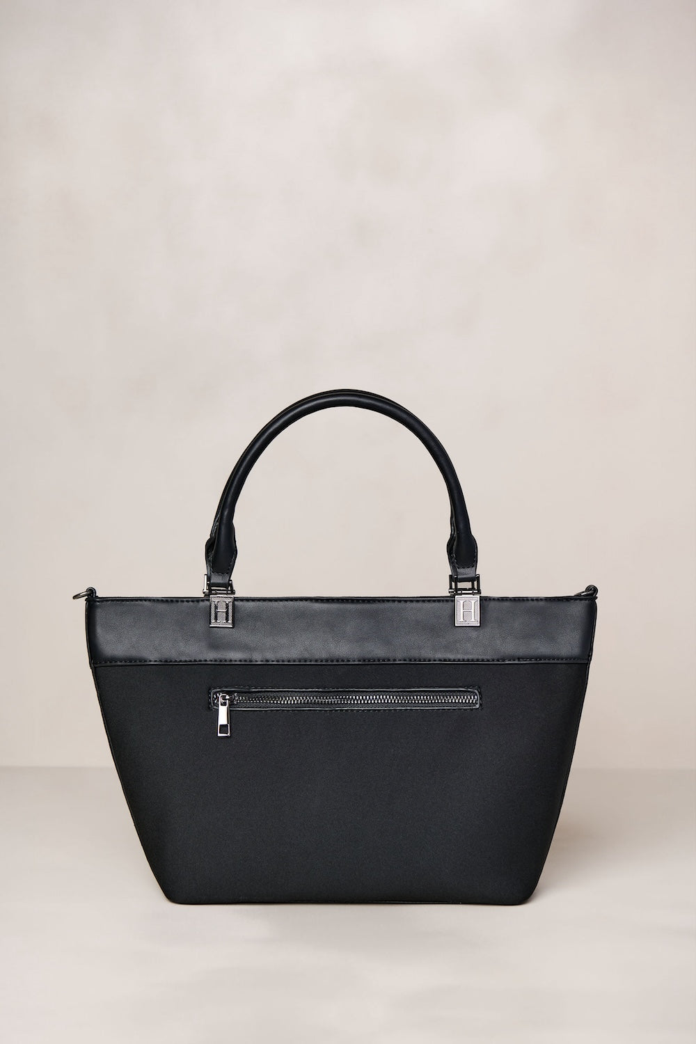 Black neoprene crossbody tote bag with handle and adjustable strap