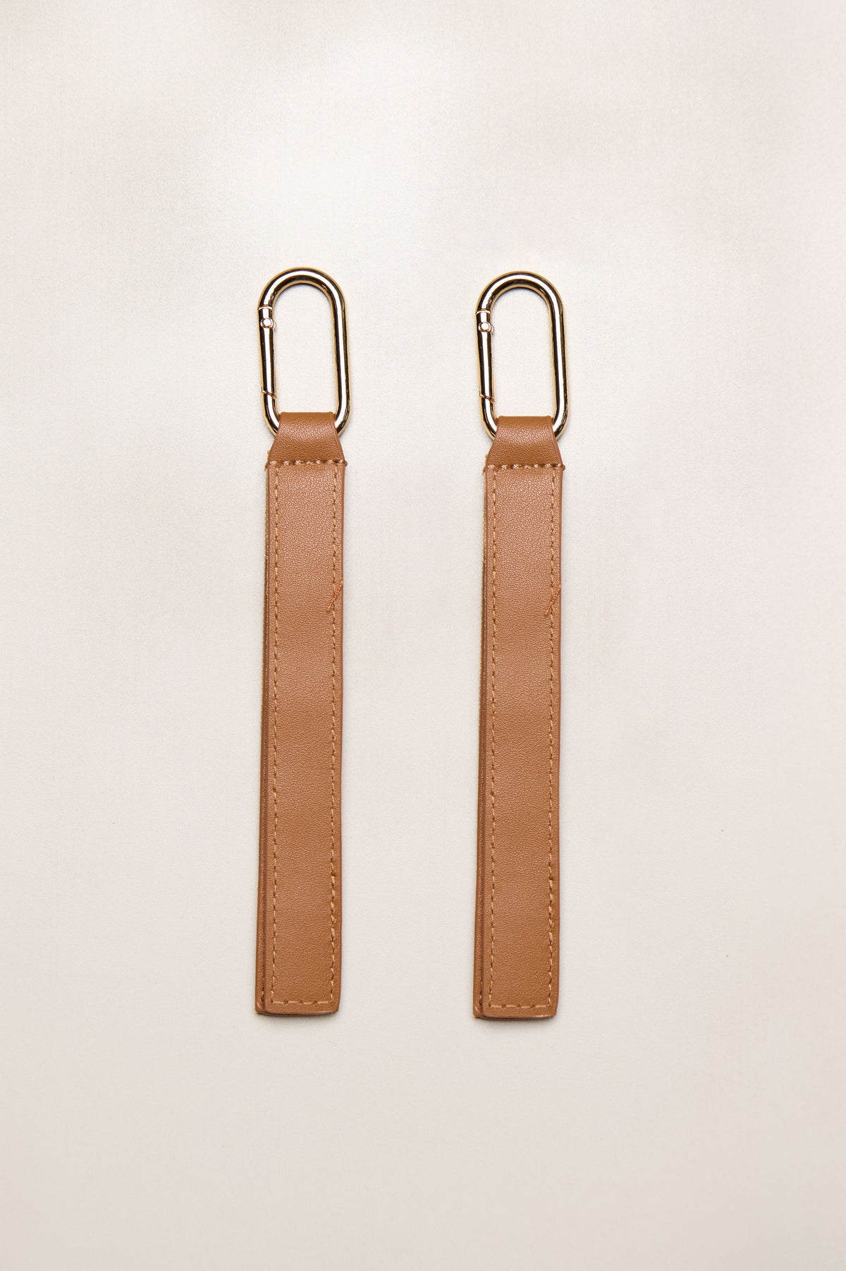 Tan leather pram straps with gold
