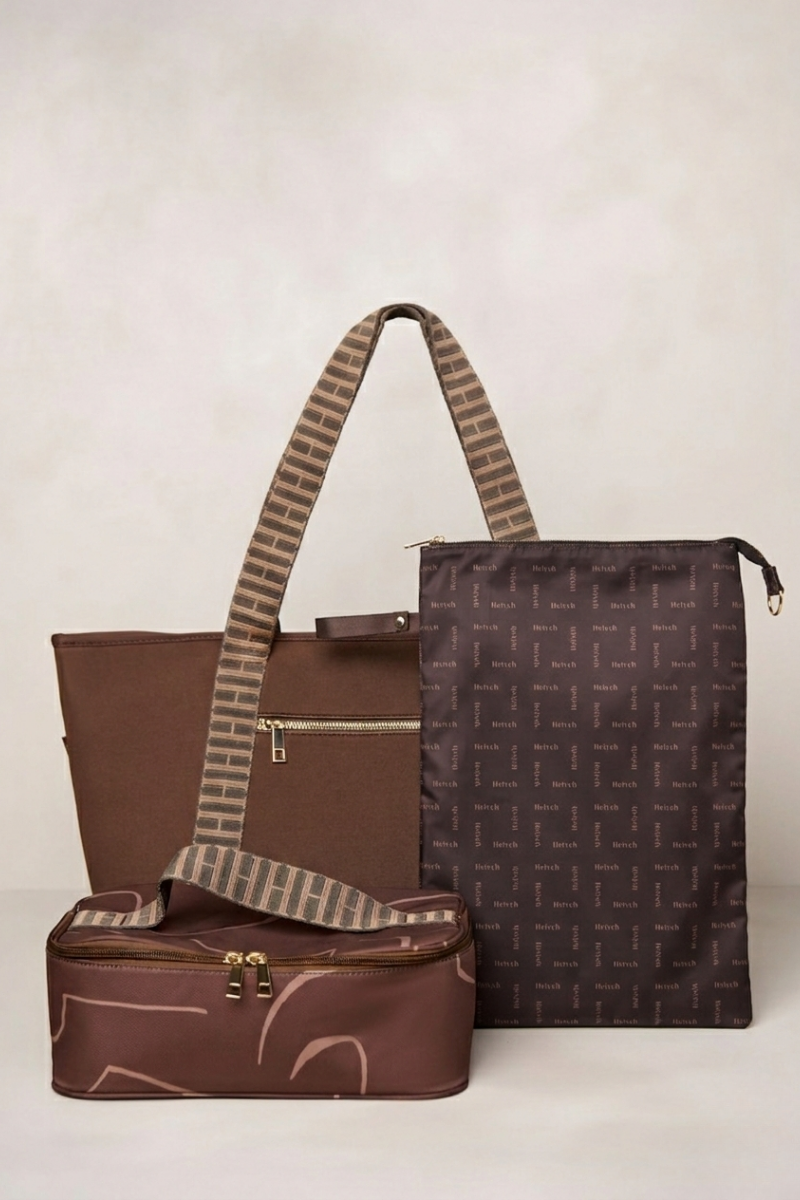 Set of chocolate brown bags with a patterned pouch on a light background