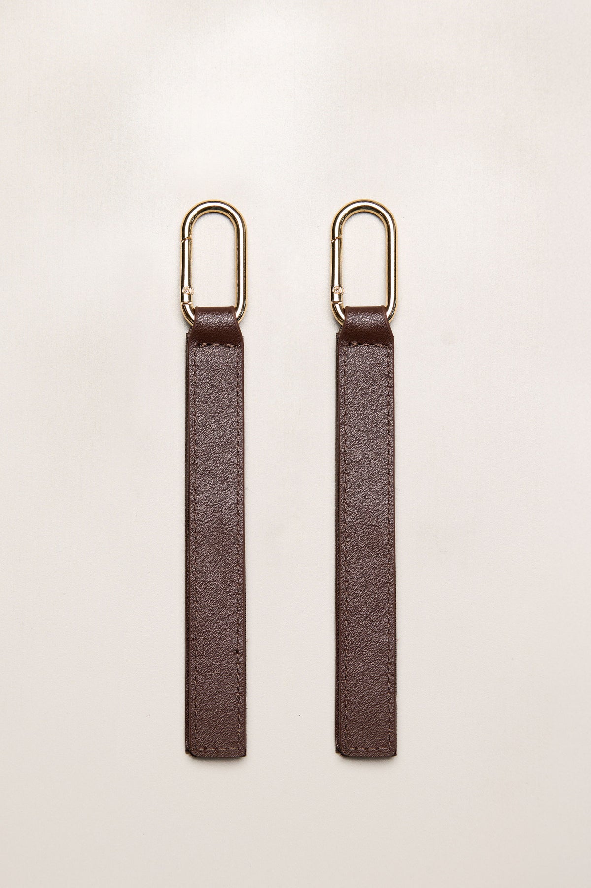 Chocolate brown leather pram straps with gold metal rings
