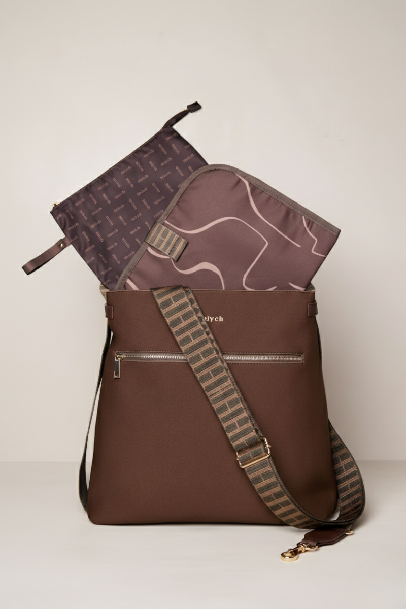 Chocolate brown shoulder bag with patterned pouches on a beige background
