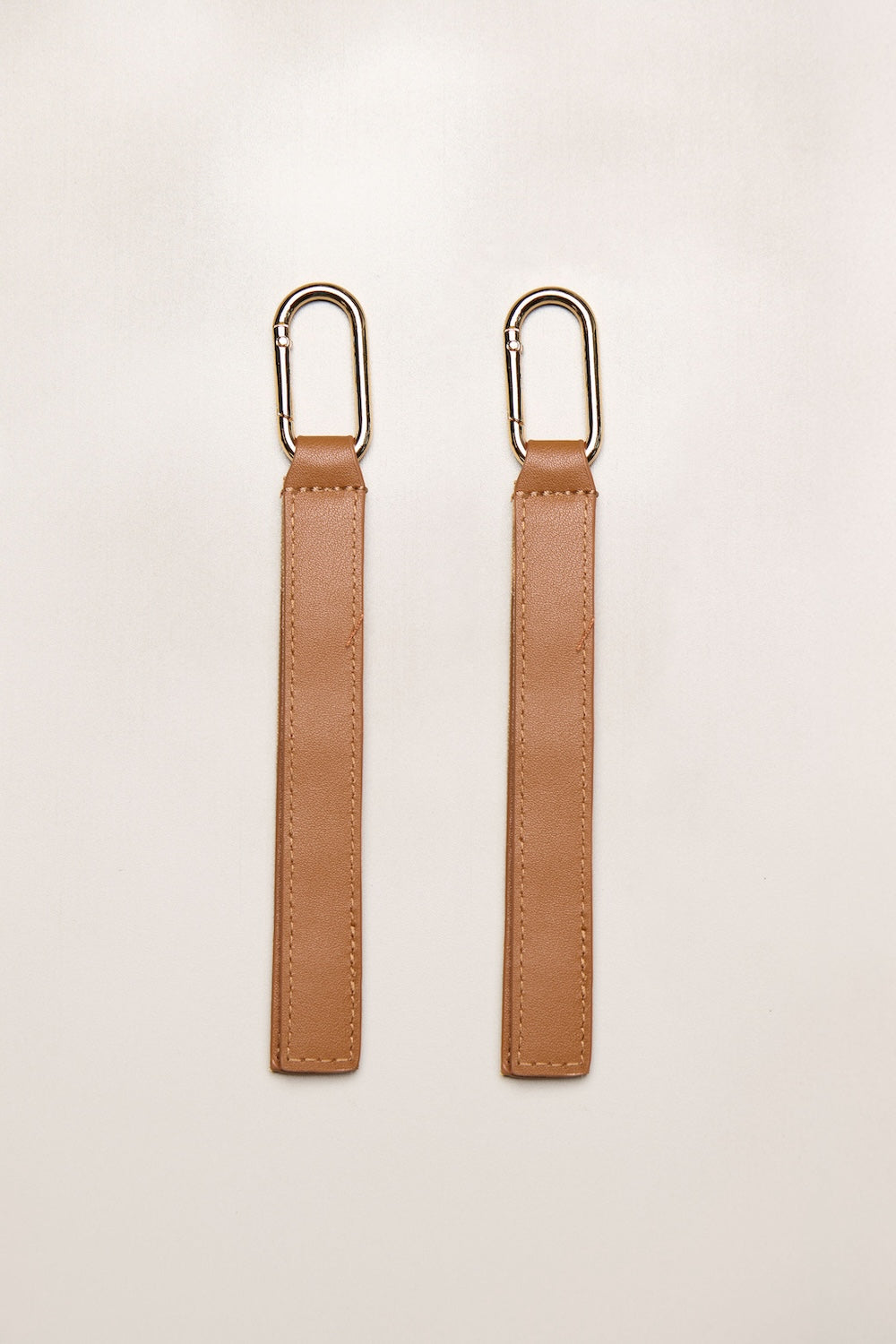 Tan Heiych H-Pram Straps for attaching bags to a pram