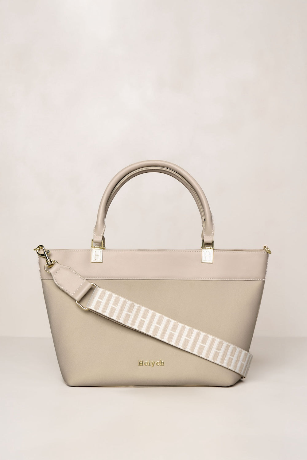Taupe neoprene crossbody tote bag with handle and adjustable strap