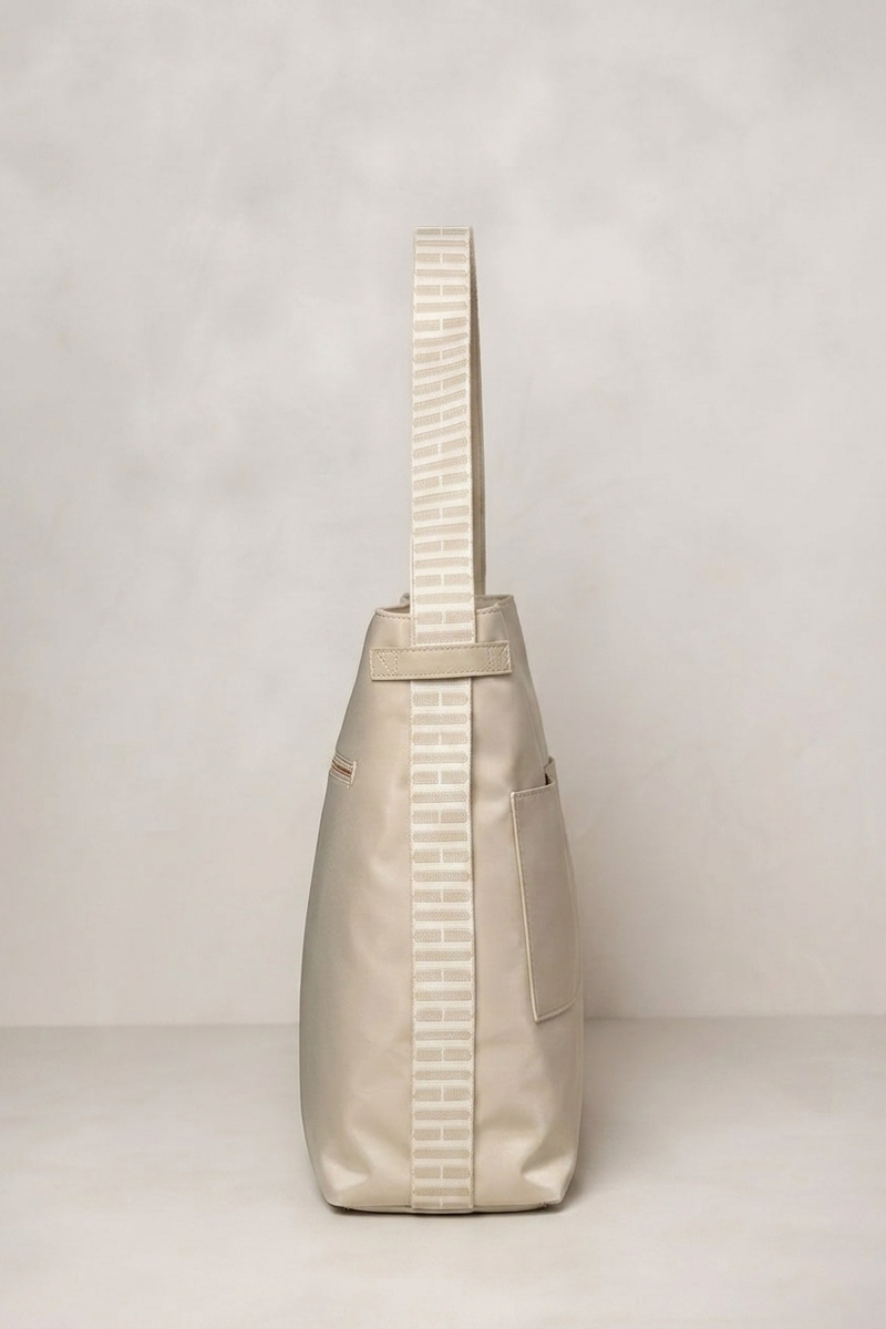 Taupe Beige backpack shoulder bag with a strap on a light gray background