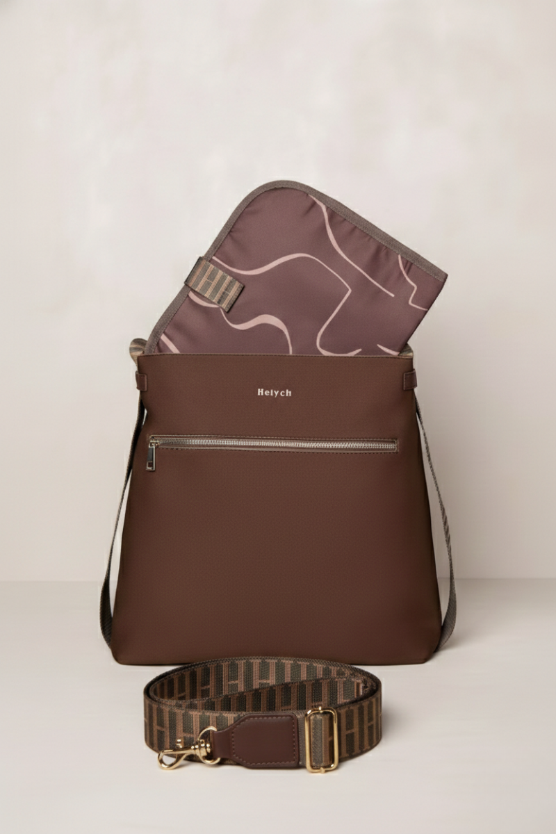 chocolate brown backpack and crossbody strap on a light background